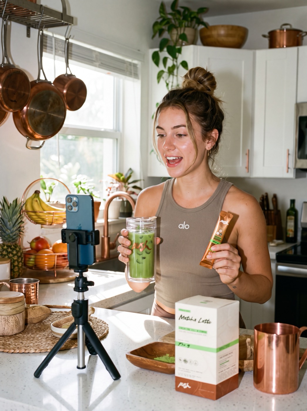 A creator filming her Push matcha latte routine in a sunny kitchen